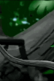 a black and white drawing of a tree branch with a green background .