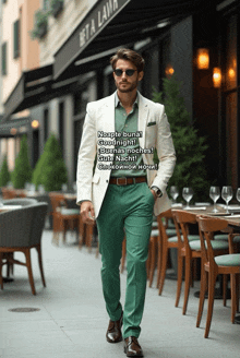 a man in a white jacket and green pants walks down a street