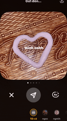 a heart shaped object is being edited on a cell phone