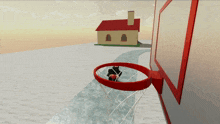 a basketball hoop with a house in the background and a person in it