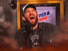 a man is laughing in front of a sign that says hyper & urine
