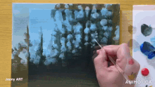 a person is painting a picture with the words made in animatica on the bottom right