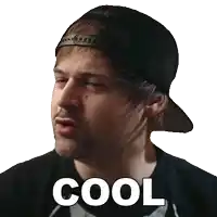 a man wearing a baseball cap and a black shirt says " cool "