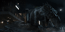 a large dinosaur is standing in front of a building with a sign on it that says ' a ' on it