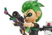 a toy with green hair is holding a purple gun .