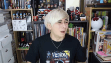 a man wearing a venom comic book t shirt