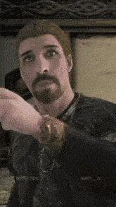 a man with a beard in a video game with rolff.clips written on the bottom