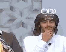 a man wearing a hat with the word redaya on it
