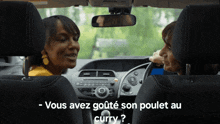 two women in a car with the words vous avez goute son poulet au curry on the bottom