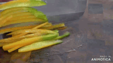 a person is cutting vegetables with a knife on a cutting board made in animotica