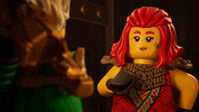 a lego figure with red hair has a tattoo on her chest