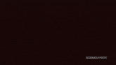 a blurry picture of a person holding a sword with the words doom written on the bottom