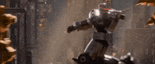 two robots are fighting each other in a dark room