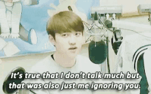 a young man is talking into a microphone and says it 's true that i don 't talk much but