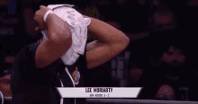 a wrestler named lee moriarty is wearing a mask on his face