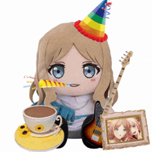a stuffed doll is wearing a party hat and holding a guitar and a cup of coffee