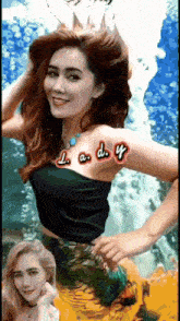 a woman in a mermaid costume has lady written on her arm