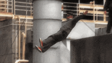 a man in a suit is falling from a rope