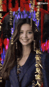 a woman is smiling in front of chinese writing and the word capcut is on the bottom right