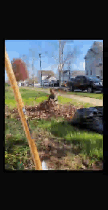 a person is standing in a field with a shovel