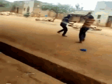 Two African Guys Fighting Men Fighting GIF - Two African Guys Fighting Men Fighting Stick Battle GIFs