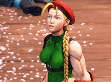 a video game character with a braid and a red hat