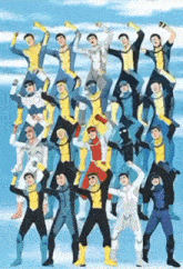 a group of people in superhero costumes are standing on top of each other