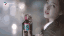a woman in a striped suit is holding a bottle of pills .