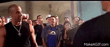 vin diesel is standing in front of a crowd of people .