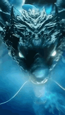 a close up of a dragon 's head with smoke coming out of it 's mouth .