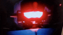 a red light is shining on a dark blue background