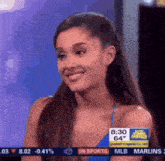 ariana grande is smiling while appearing on a tv show