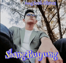 a man in a suit and glasses with the words long beach allstars shang buyung on the bottom
