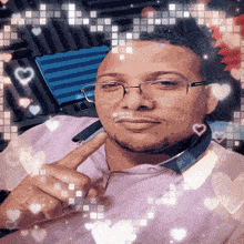 a man wearing glasses and a pink shirt has hearts around him