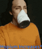 a man wearing a mask that says hopium increases *
