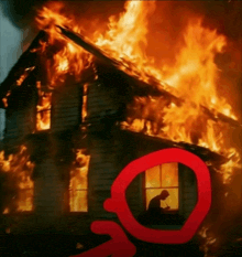 a burning house with a red circle around the window