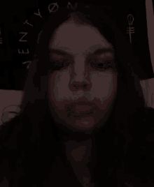 a close up of a person 's face with the word envy written on a black background