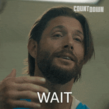 a man with long hair and a beard says wait in a countdown ad