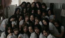 a group of young women are posing for a photo