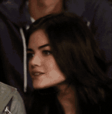 a close up of a woman 's face with her eyes closed