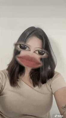 a woman is taking a selfie with a mask on her face that looks like a duck