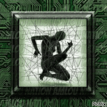 a silhouette of a person kneeling in front of a green circuit board ..