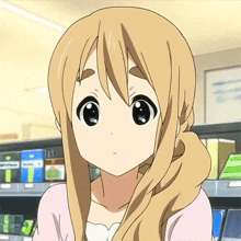 a close up of a girl 's face with a ponytail