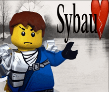 a lego character with a broken heart and the word sybau on the bottom right