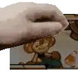 a pixel art of a hand holding a cookie in front of a picture of a girl .