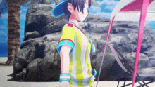 a girl in a striped shirt is standing in front of a pink umbrella