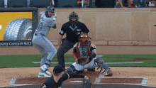 a baseball player with the number 18 on his jersey swings at a ball