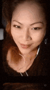 a close up of a woman wearing headphones