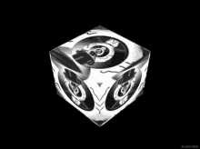 a black and white cube that says diskomo on the bottom right