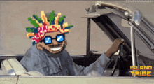 a pixel art of a man in a car with the words island tribe written below him
